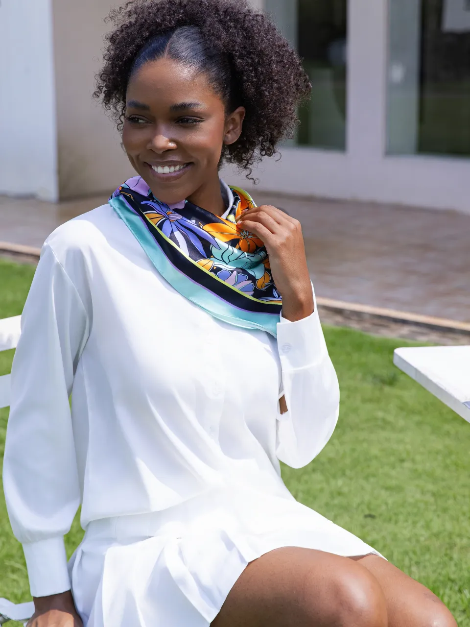 Allover Floral Silk Scarf-Aqua/Lavender/Orange/Yellow in Aqua/Black — styled around the neck