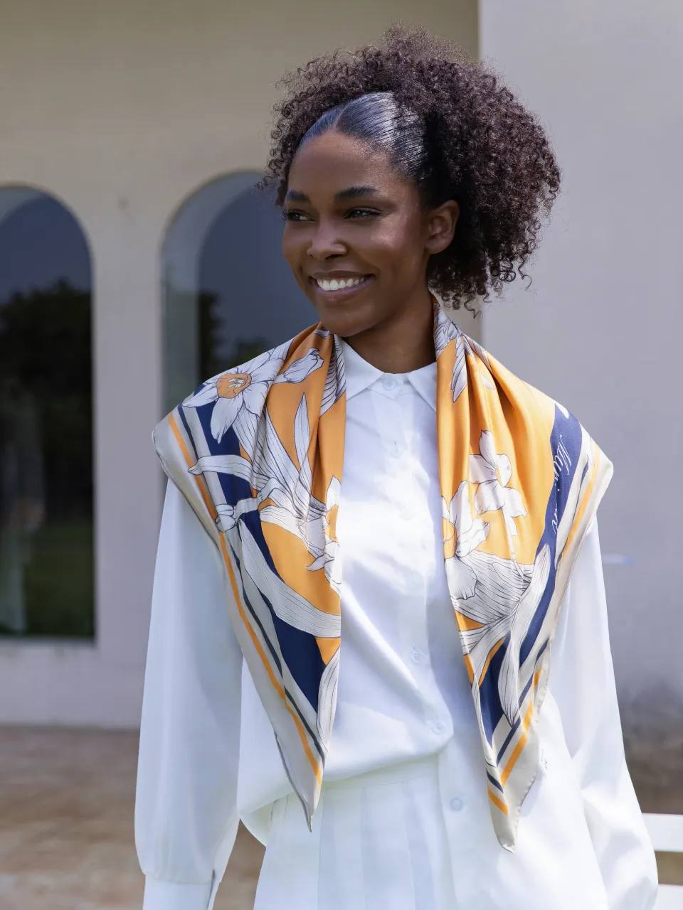 Narcissus & Swallows Silk Scarf-Orange/Navy — draped over the shoulders