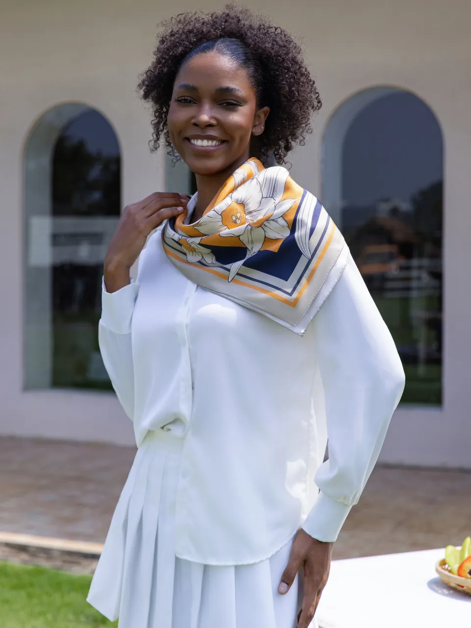 Narcissus & Swallows Silk Scarf-Orange/Navy — styled around the neck