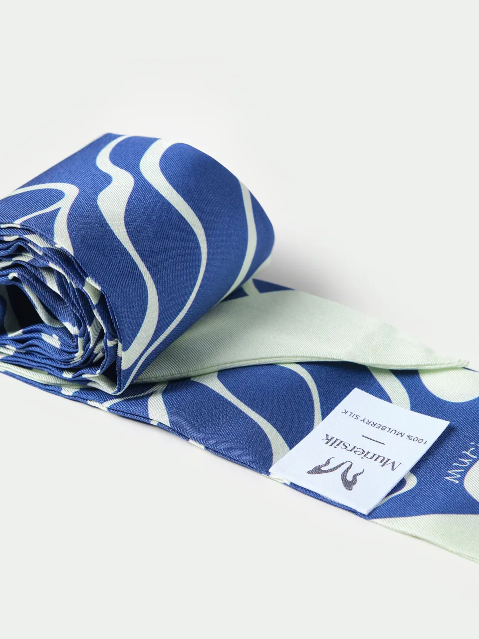 Twill Silk Skinny Scarf Ribbon, Hair Tie & Bag Accessory in Blue — rolled scarf and fabric label