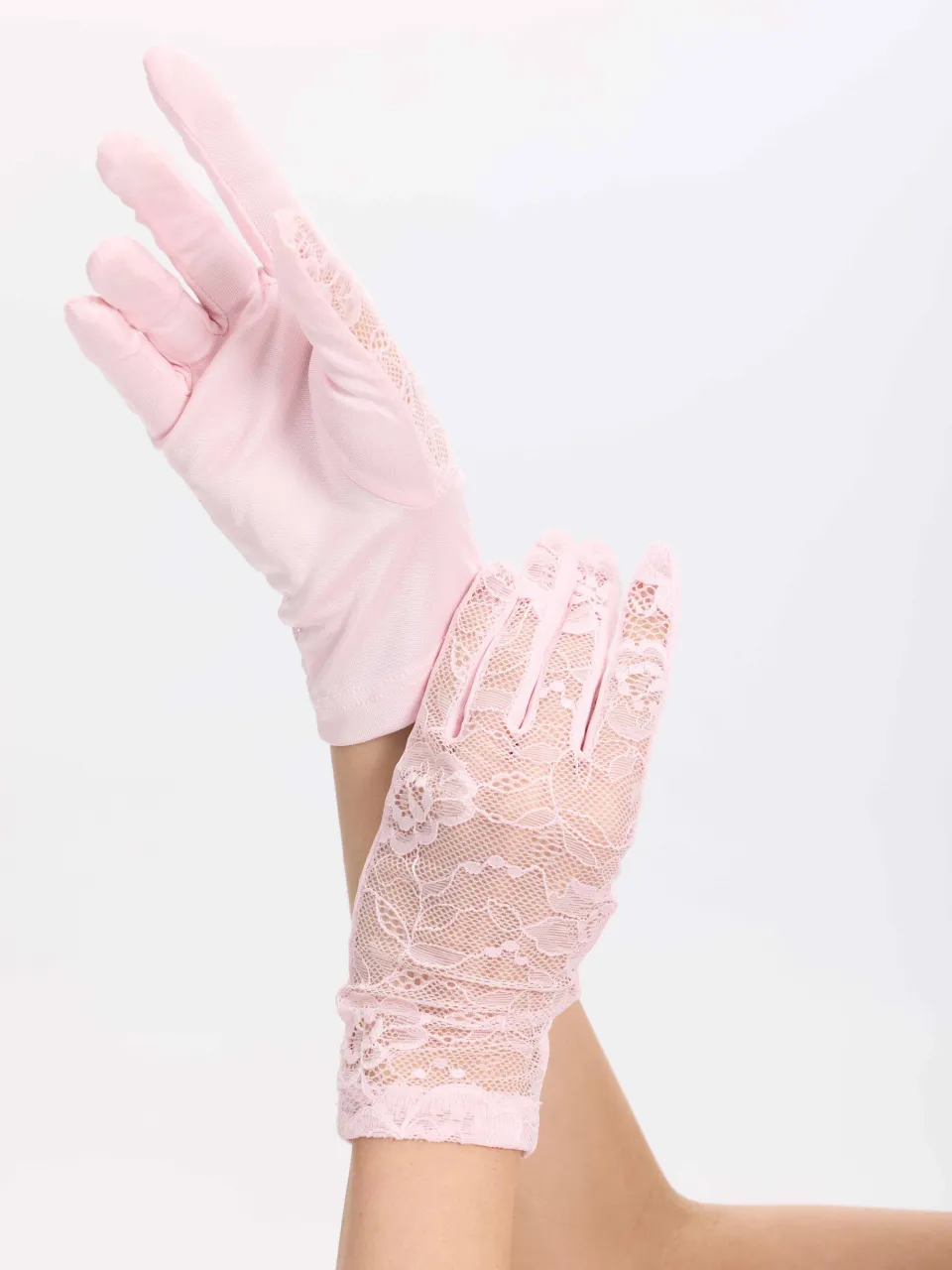 Mulberry Silk & Floral Lace Gloves in Pink — close-up of lace gloves on hands