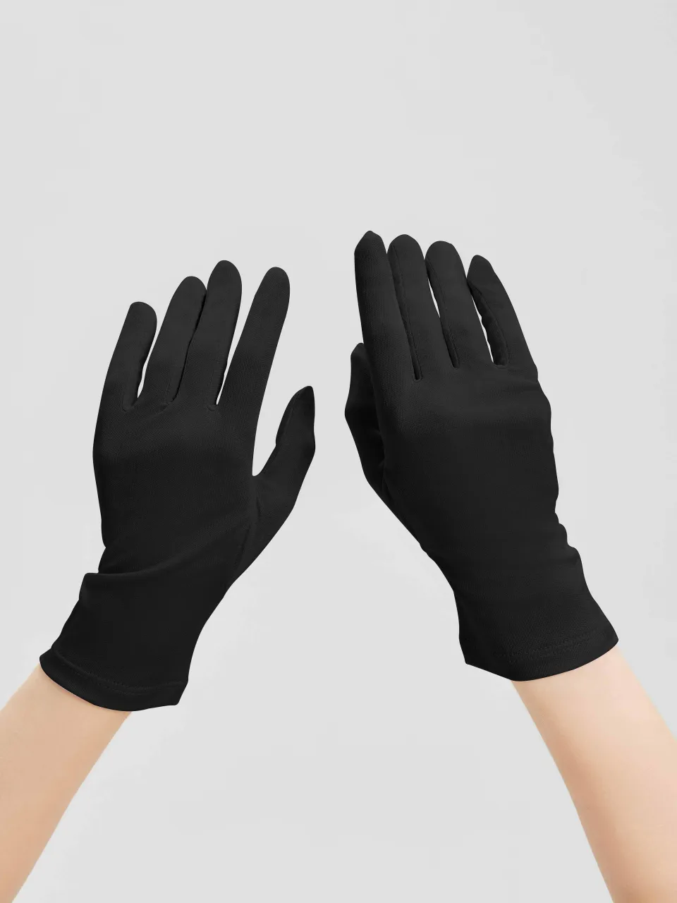 100% Mulberry Silk Knit Gloves in Black — close-up of gloves on hands