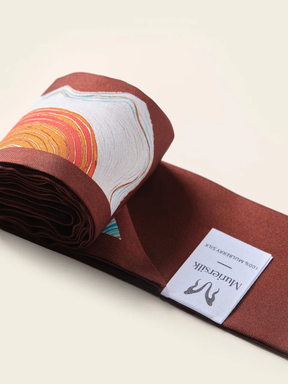 Twill Silk Skinny Scarf Ribbon, Abstract Print Hair Tie & Bag Accessory, on an oat backdrop