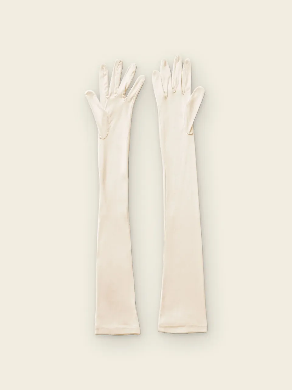 Mulberry Silk Sleep Gloves, on an oat backdrop